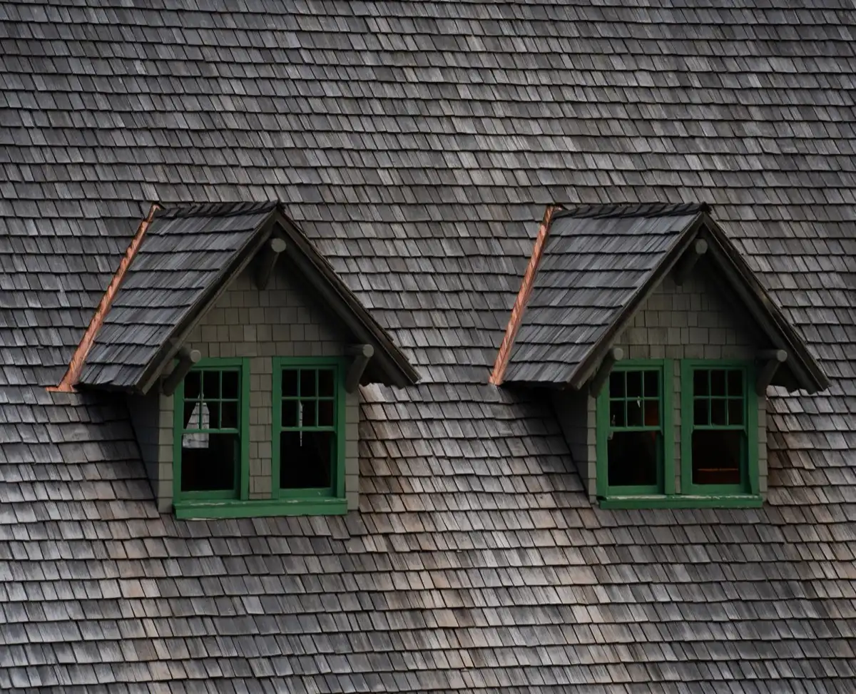 Dormers on a shingle roof in Hayward, CA, where step flashing and kickout flashing carry water past the walls